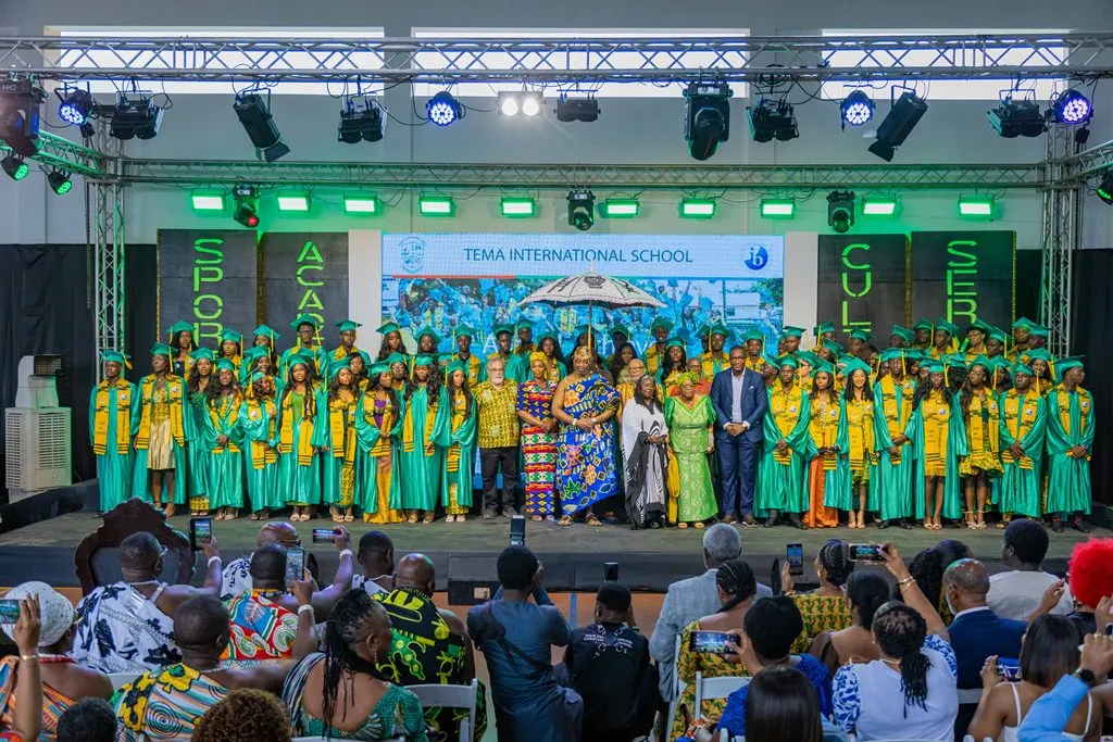 Graduating class of Tema International School (TIS) on stage during the 2026 commencement ceremony with faculty and traditional leaders